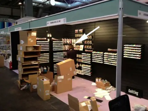 Me (@KreinikGirl) working hard, setting up the Kreinik booth at the Craft Hobby + Stitch International trade show