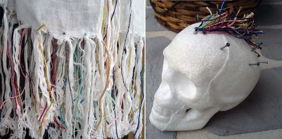 Upcycling even the least expensive things by the addition of colorful fibers: metallic thread bits add visual interest to plain fringe on a purchased scarf, or crazy hair on a styrofoam skull.