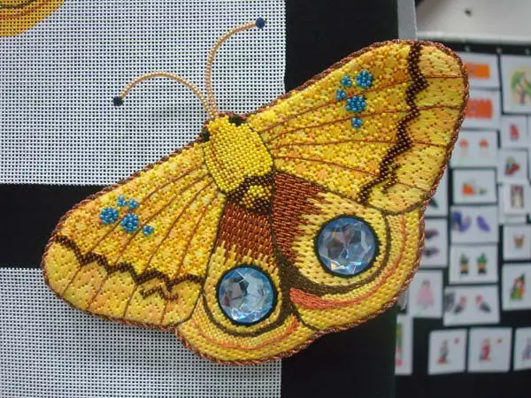 Metallic threads, silk threads, cabochons and beads combine to make a stunningly gorgeous stitched butterfly.