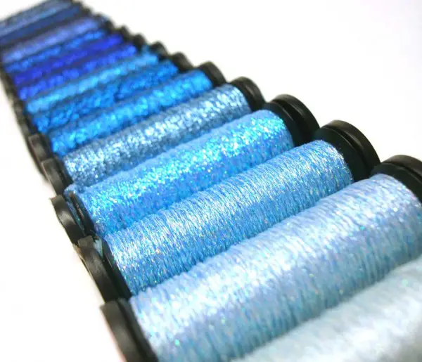 The blue thread group covers hues from light to dark, from pastel to jewel tones, with a few variegated blends in between.
