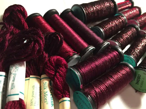 There are several "Marsala" families in the Kreinik thread lines, both silk and metallic threads for hand and machine embroidery. Look for metallic colors 031L and 080HL, or silk colors 1098, 1107, 1119.