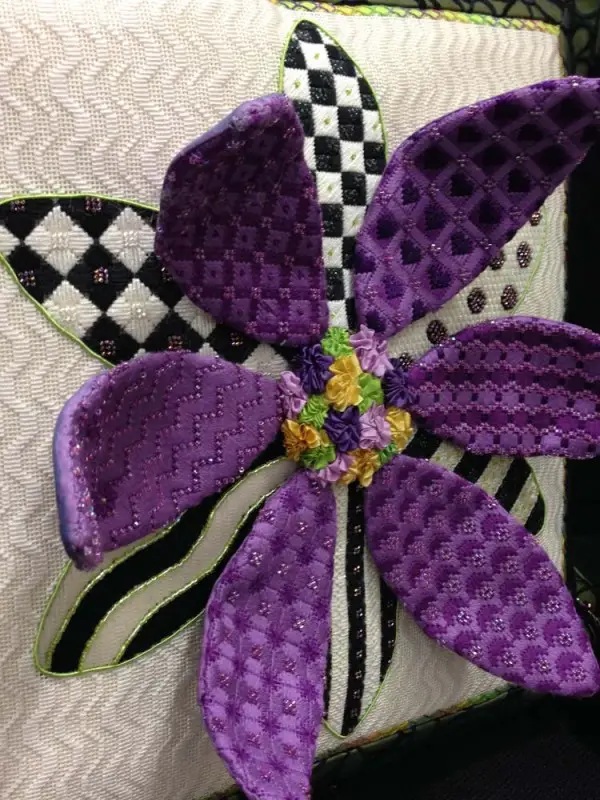 Pretty in purple, this daisy stands out for...well, standing out. It's called "3-D Daisy" and is from the design company Sew Much Fun. Can you spot the Kreinik metallics?