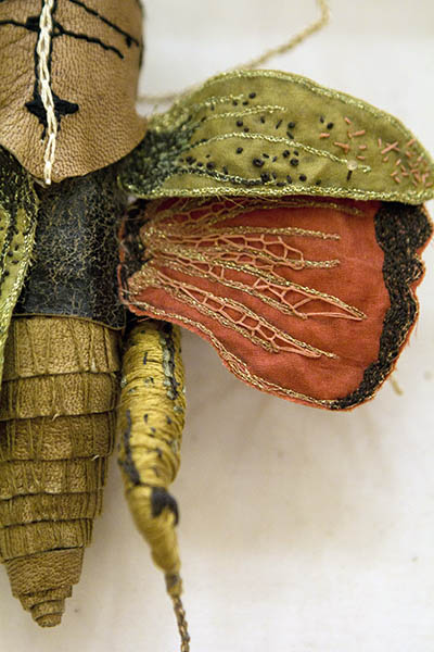 Embroidered grasshopper by Jenna Lagonigro