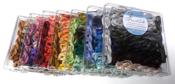 These boxes are new thread collections from Kreinik, featuring French silk floss in color groups. Silk takes dyes deep into its celllular level, unlike cotton, so colors are richer. These sets are perfect for beginners, fiber artists, and others wanting to experiment with silk. From http://www.kreinik.com/shops/French-Silk-Sets/