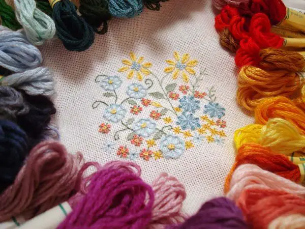 This embroidery sample shows Kreinik Silk Mori, stitched on an evenweave fabric. Use one or more strands of the silk floss depending on your stitches and effect you want to achieve. Pattern available here: http://www.kreinik.com/shops/Enchanted-Garden.html