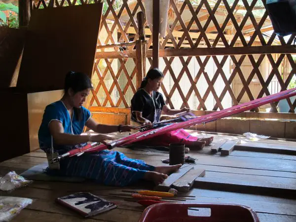 Women weaving at home. 