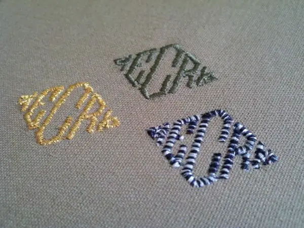 3 monograms stitched in different thread types.