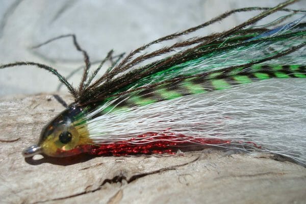 I don't know the name of this lure (share with a fly fishing friend, I bet they'll know), but I love the mixed media involved in making it. Can you spot the feathers?