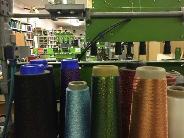 After a day's work, the area was pretty quiet. Wouldn't be long, though before the braiding, coning, spooling, labeling, and packaging would begin. Imagine the sounds of thread being made for you.