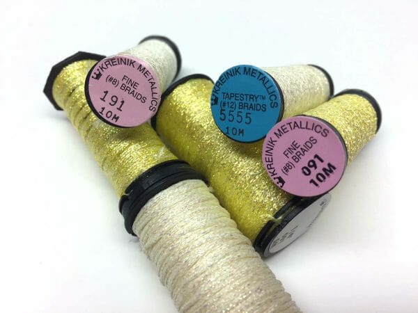 For those who prefer an edgier take on snow stitches, how about, ahem, yellow snow? I like Kreinik color 5555, or 191 or 091. 