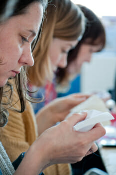 Craftivists in Liverpool reflecting on the issue whilst doing their meditative stitching session. 