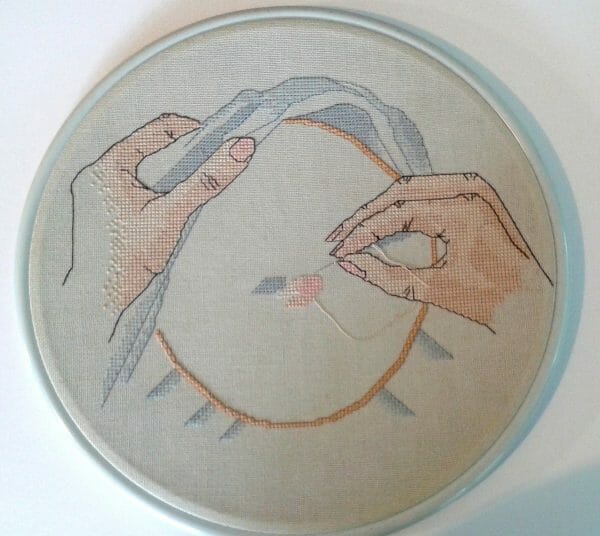 Cherry Parker's first published design "Hands" in Just Cross Stitch Magazine