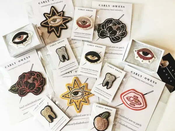 A selection of Carlys patches and pins.