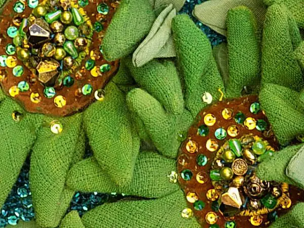 Petals are painted in 'Green Sunflowers' to give structure to the open weave cotton fabric.