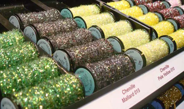 Kreinik Micro-Ice Chenille is a fuzzy thread that you couch on the surface of fabric, needlepoint, embroidery or cross stitch.