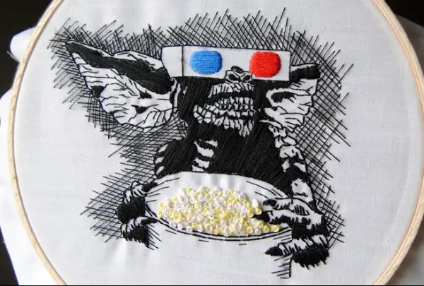 Gremlins, with popcorn. Hand Embroidery.