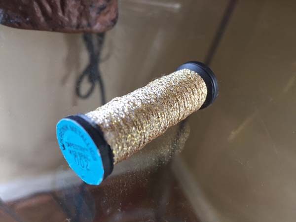 Over the years here at Kreinik, we have seen the most damage done to spools when wrapped with rubber bands. Just say no to rubber bands!