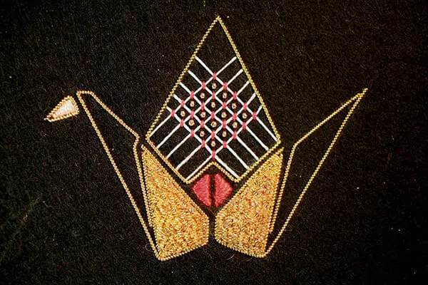 Detail of origami crane in embroidery, by Annalisa Middleton