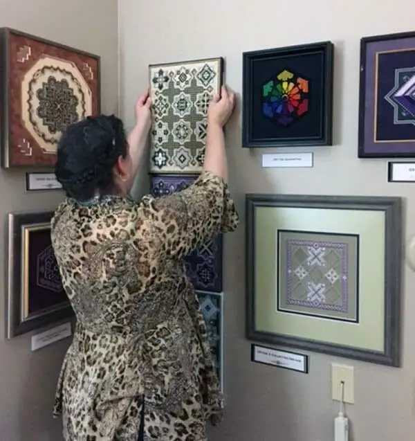 I took this photo of Textured Treasures designer Karen Dudzinski at a recent trade show. It shows a small amount of her wonderful design line. If you are interested in charted/counted needlepoint/canvaswork, look her up.