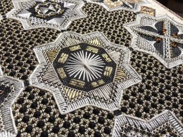 The white Rhodes stitch at the center of this motif is a great stitch to use for flower centers. Look it up online and give it a try using any thread. Design: Dawn to Dusk by Karen Dudzinski
