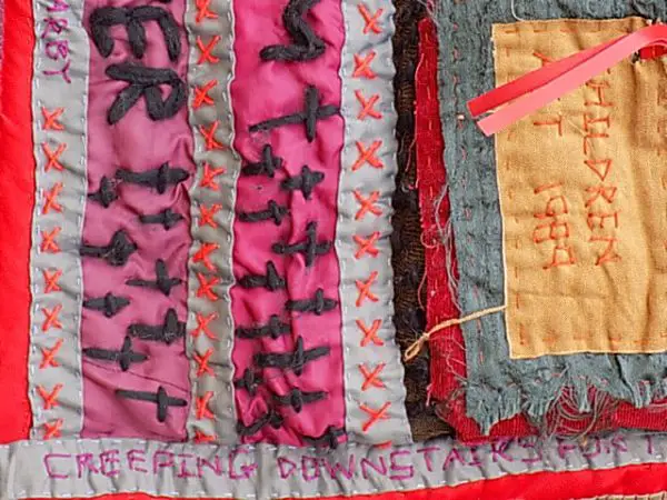 Using wool and silk threads to embroider poetry in textiles